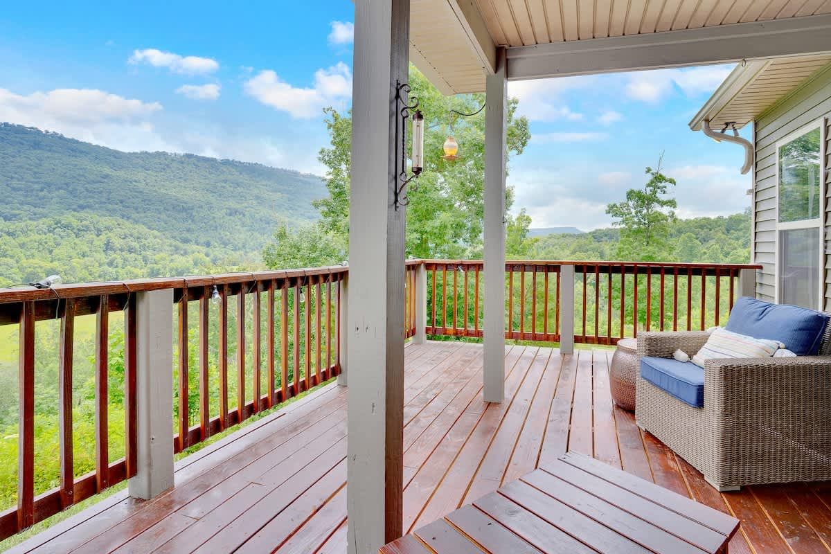 Covered deck looking out over forested hills