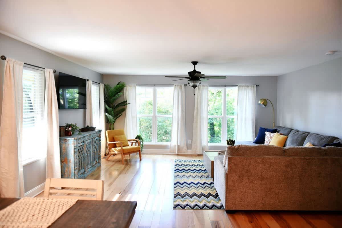 Living room with big windows and a patterned rug