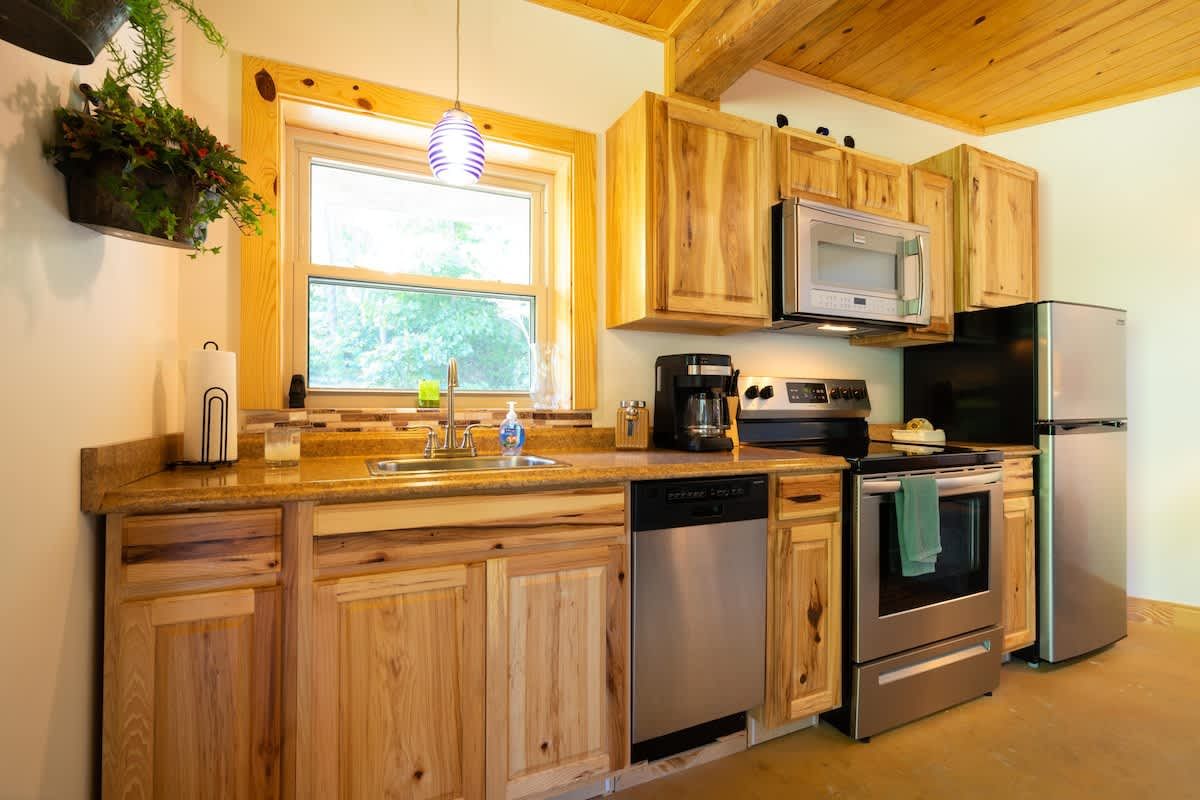 Kitchen with hickory cabinets and stainless appliances