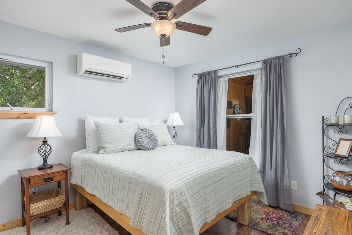 Bedroom with a ceiling fan and soft light