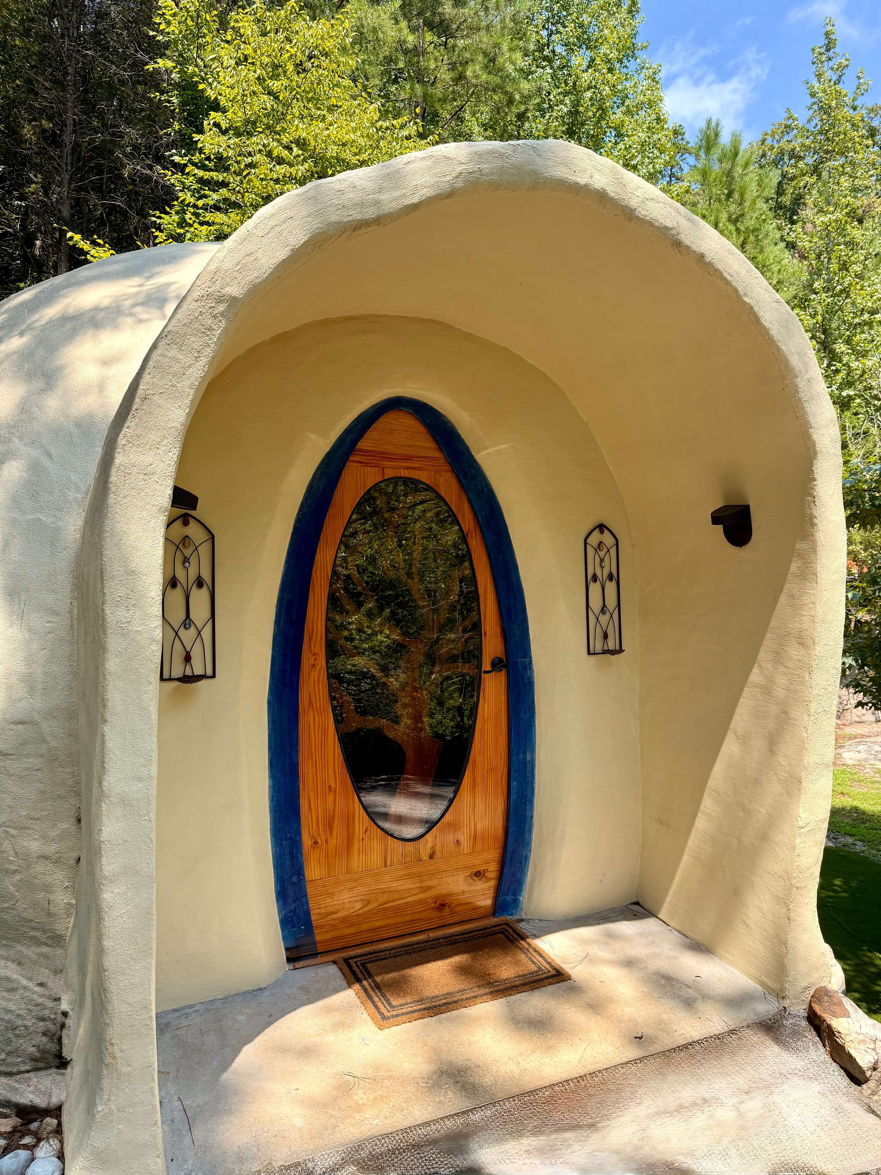 Oval front door set into the curved dome wall