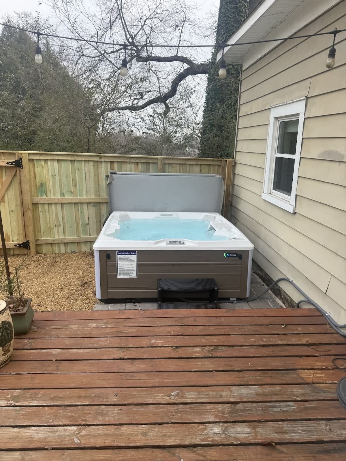 Hot tub in the fenced backyard