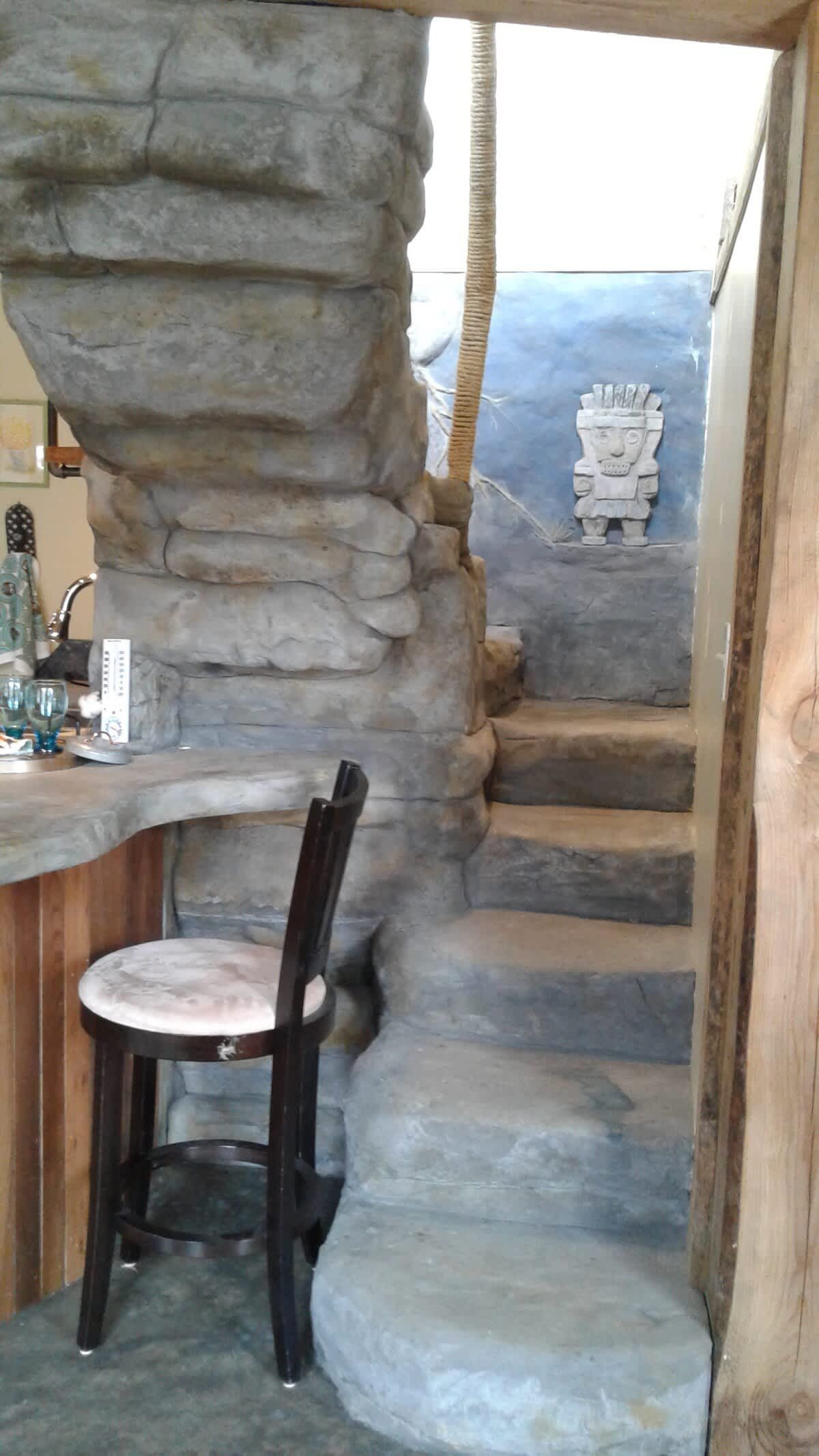 Stone steps curving up to the loft