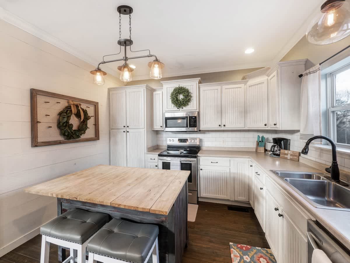 White kitchen with a butcher-block island